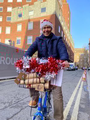 santa-on-bike-delivering-presents-sustainable